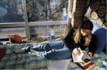 Teenager on a bed reading