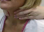Palpate the thyroid gland