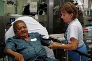 Nurse checking a blood pressure on a patient.