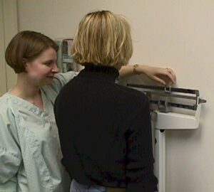 Patient being weighed